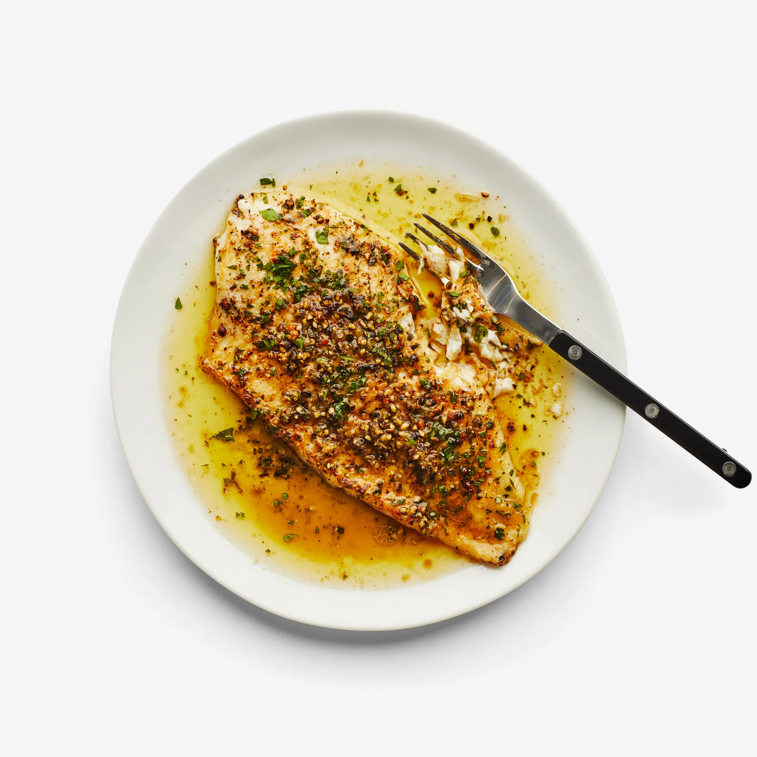 BLACK-PEPPER FISH ON A SIZZLER